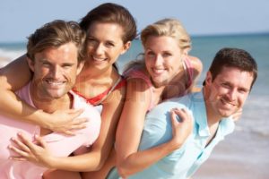 "Group Of Friends Enjoying Beach Holiday, stock photo"